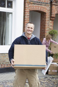 Twickenham Man And Van team carefully loading furniture with protective equipment
