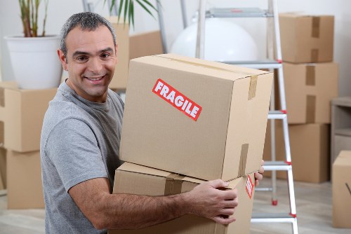Removal van and moving crew preparing a residential move in Twickenham