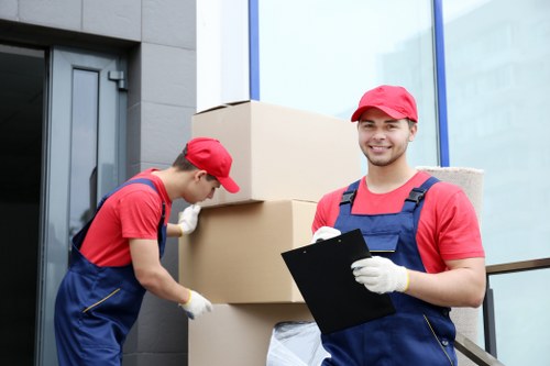 Removal van and moving team in a Twickenham residential street