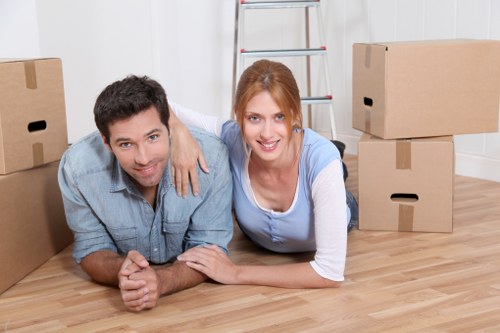 Local movers handling furniture in a Twickenham property