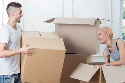 Office relocation setup showing desks and boxes prepared for transport in Twickenham