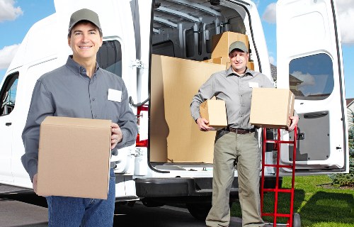Packed moving boxes and furniture ready for loading