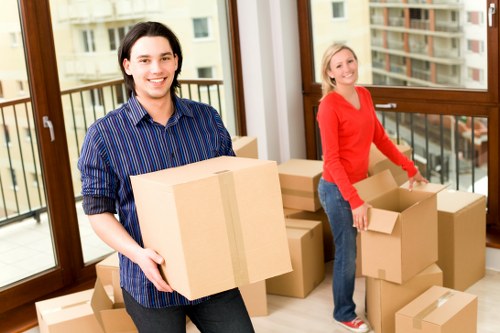 Packed office boxes and desks ready for relocation in Twickenham